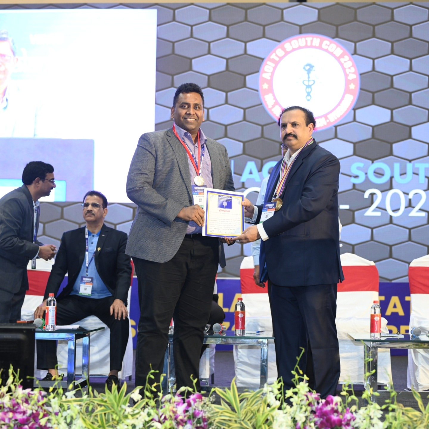 Dr. Asheesh Dora receiving State Award at AOI TG SOUTH CON 2024